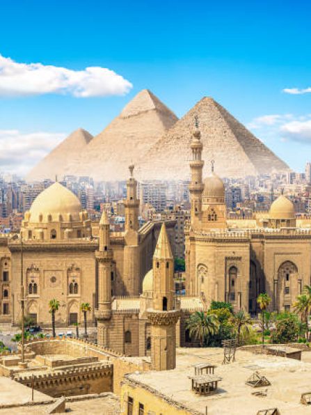 View of the Mosque Sultan Hassan in Cairo and pyramids